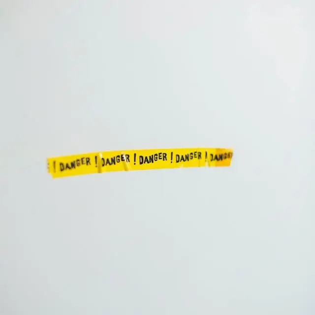 yellow danger tape on wall
